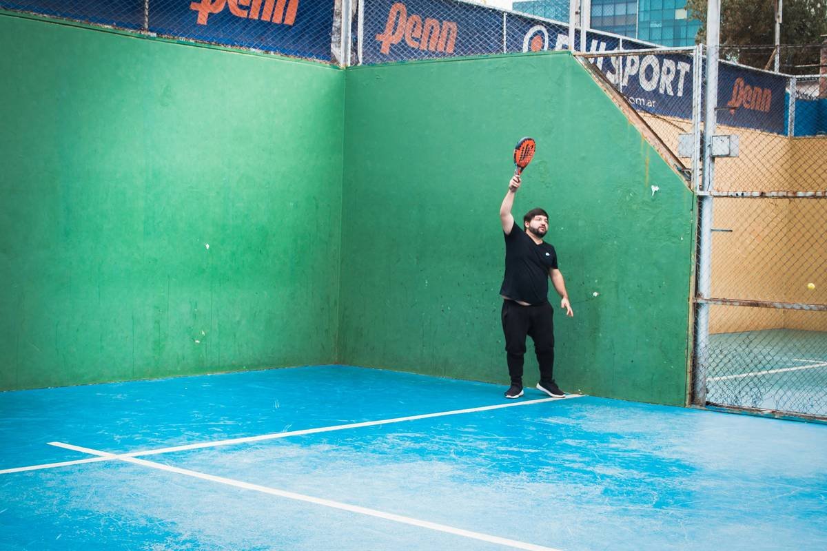 Player executing correct defensive lob height in padel match